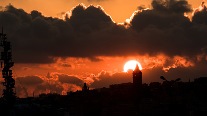 Fototapeta premium The sun sinking behind the Galata Tower