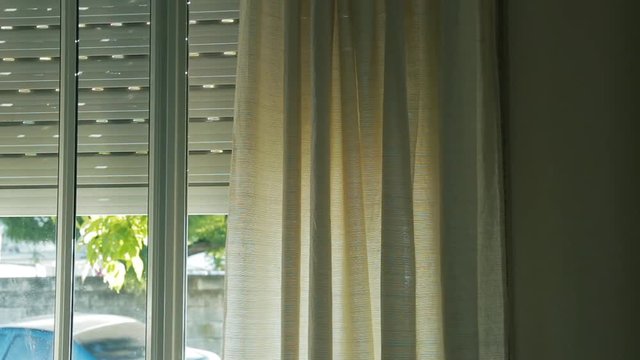 Curtains Moving by the Wind in a Window. Zoom In Shot.