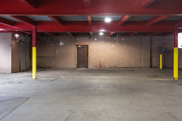 Red beams inside parking garage