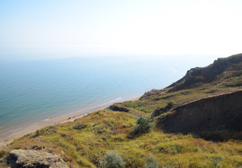 The hilly coast near the Sea of Azov. Clay rocks, a cliff on the shore.