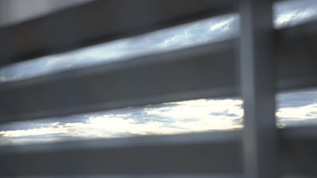young girl standing at the rooftop and watching