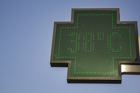 Pharmacy sign marks the temperature in degrees Celsius . 38 °C (100,4 Fahrenheit) at 7p.m. on one of the hottest days in Europe.
