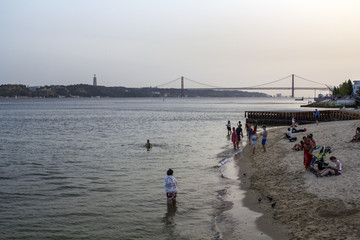 LISBON, PORTUGAL - August, CIRCA 2018: People are cooling at tagus river on one of the hottest summer days in Portugal