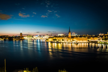 Fototapeta na wymiar Panoramic view of Old Town in Sweden - Stockholm (Gamla Stan) in a summer night. Reflection