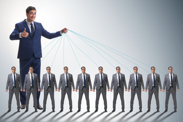 Boss employee manipulating his staff in business concept
