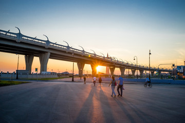 Western Speed Diameter, Lakhta Center and the sun at sunset in St. Petersburg in the summer. Russia