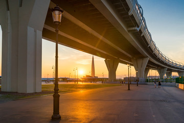Western Speed Diameter, Lakhta Center and the sun at sunset in St. Petersburg in the summer. Russia