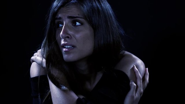 Woman alone at night on street scared feeling fear horror