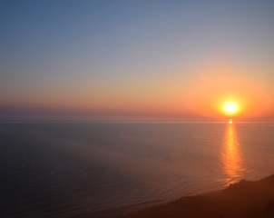 Fototapeta na wymiar Dawn over the sea. Sea of Azov. Morning mist over the shore. Sunrise