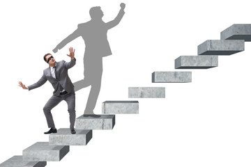 Businessman and his shadow in business concept