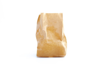crumpled brown paper bag on white background.