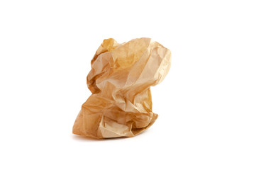 crumpled brown paper bag on white background.