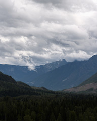 Obraz na płótnie Canvas Heavy rain moves across a dramatic valley in the Canadian wilderness