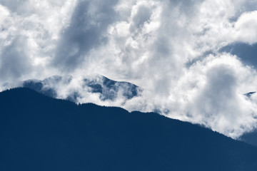Fototapeta premium Dramatic morning mist rises over the rocky mountains in British Columbia