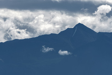 Dramatic morning mist rises over the rocky mountains in British Columbia