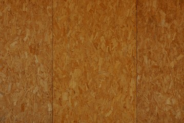 brown wooden texture of a plywood board in the wall