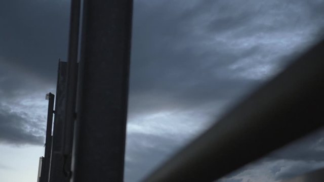 a dramatic dark sunset sky with black concrete elements