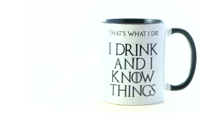 I drink and I know things quote coffee mug on white background.