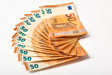 Euro money bank. Rolled up Euro bills on white background. One hundred and 50 Euro bills