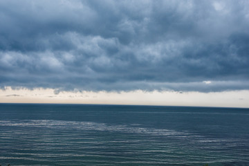 Thunderheads in August over the ocean off Fishers Island in Long Island Sound at dusk