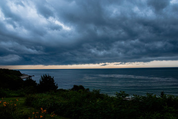 Thunderheads in August over the ocean off Fishers Island in Long Island Sound at dusk