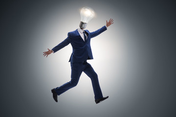 Fototapeta na wymiar Businessman in bright idea concept with lightbulb head