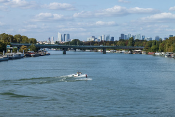 Water skiing on the Seine between Saint-Cloud and Boulogne Billancourt with La Défense in the background 01