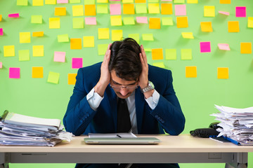 Businessman having trouble with his priorities