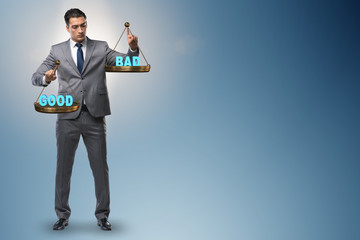 Businessman choosing between good and bad