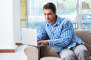 Caucasian student with laptop preparing for university exams