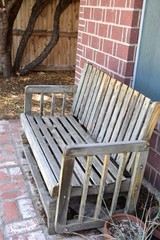 Fototapeta na wymiar Wooden bench on patio