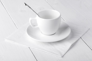 Fototapeta na wymiar empy coffee-house cup with spoon and saucer
