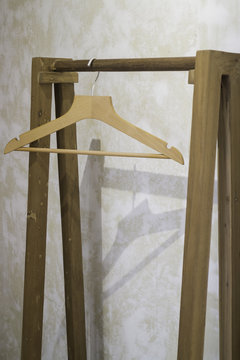Single wooden hanger on pole