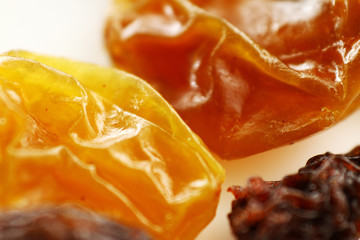 Fototapeta na wymiar Close up raisin texture as background / A raisin is a dried grape. Raisins are produced in many regions of the world and may be eaten raw or used in cooking, baking, and brewing