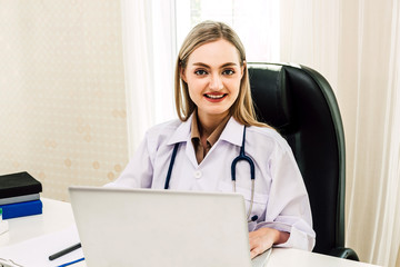 Doctor and stethoscope working with laptop computer in hospital.healthcare and medicine