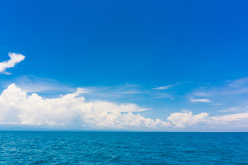 Naklejka na ściany i meble Blue sky with cloud in sea background