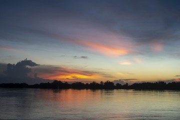 The beauty of cold light on the river./The beauty of Twilight light on the Mekong River / evening light after sunset on the Mekong River.