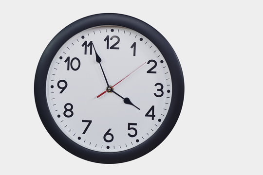 Time concept with black clock at three to four am or pm
