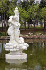 Obraz premium mermaid statue in a park, china