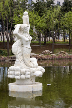 mermaid statue in a park, china