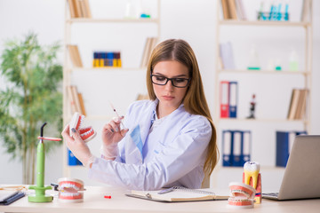 Dentistry student practicing skills in classroom