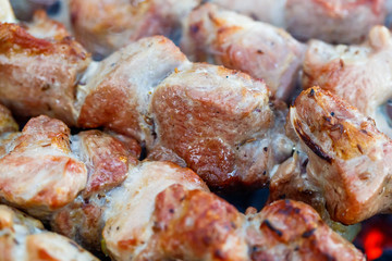 Barbecue skewers with meat on the brazier. Pork shish kebab