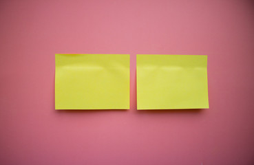 Сolorful blank sticky note or empty post notes with office clamps on pink background