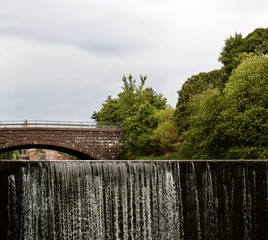 Waterfall of Vanhakaupunki on Vantaanjoki river in Old Town Helsinki at summer