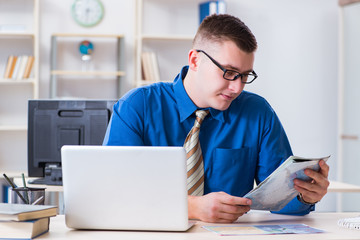 Young employee preparing for vacation trip 