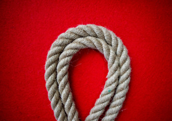 Rope on colorful red background