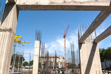 construction of a new building, concrete frame and reinforcement with crane, general view