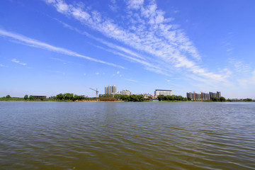 Fototapeta premium Wide water surface and buildings