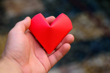 Man hand is giving heart.