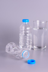 The empty bottles are crushed and flattened..